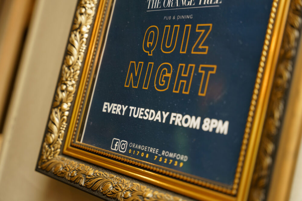 A lively Tuesday Night Quiz atmosphere at The Orange Tree – friends, fun, and brain-teasing questions.
